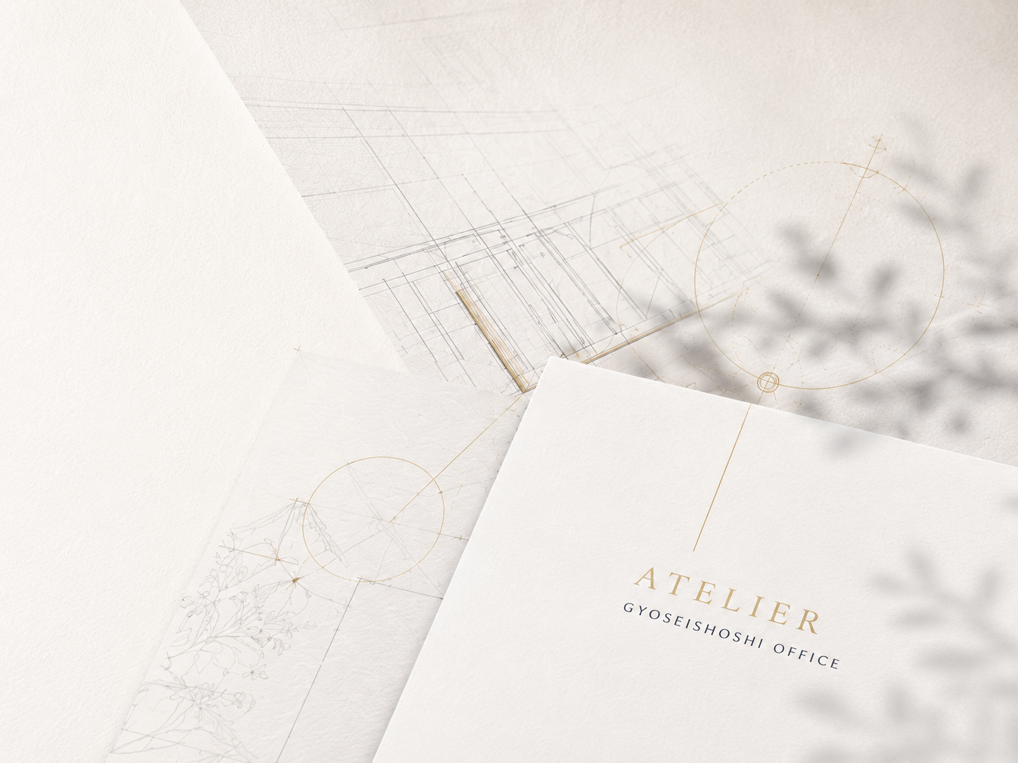 ATELIER行政書士事務所 — 設計図と便箋のモックアップ